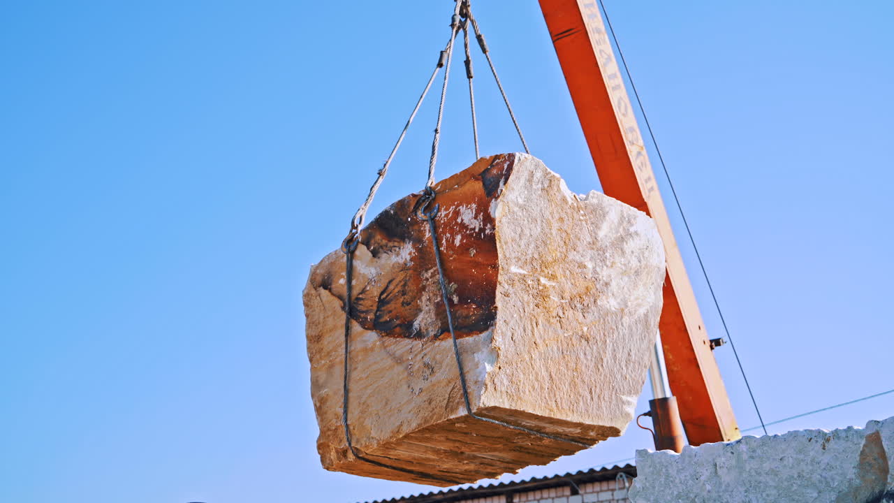 Marble blocks and crane on quarry. Crane machine and equipment for construction site