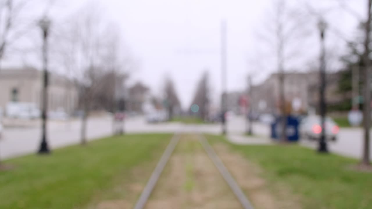 A wide shot of a small downtown area in Kenosha, Wisconsin shot in an establishing style format beginning out of focus and slowly moving into focus.