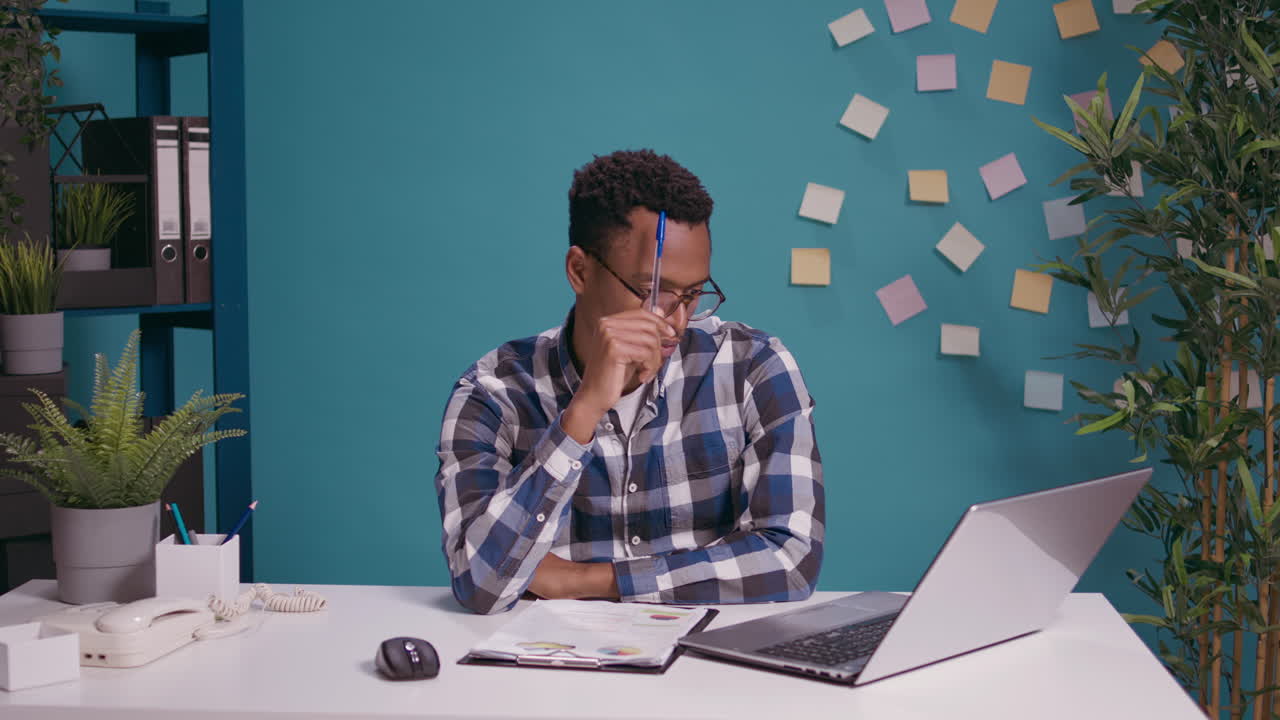 Thoughtful employee brainstorming ideas to plan business strategy
