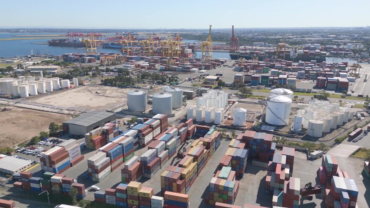 Aerial flight over shipping containers and cargo at Port Botany, Sydney NSW, Australia