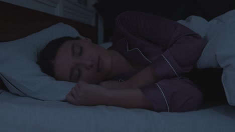 woman sleeping in bed at night