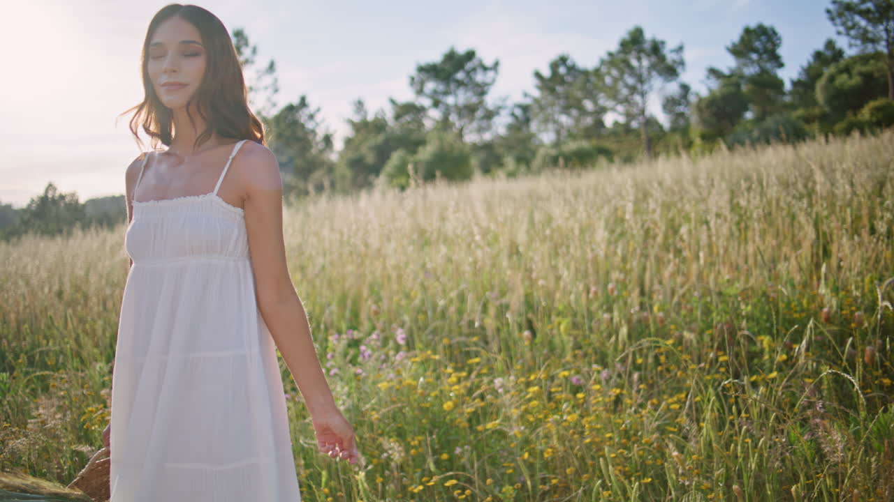 Rural woman strolling meadow holding basket closeup. Lady walking in summer