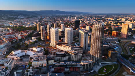 bratislava, slovakia - june 14, 2025: bratislava's modern skyline. bratislava city features a stunning skyline filled with modern buildings and vibrant urban life during sunset
