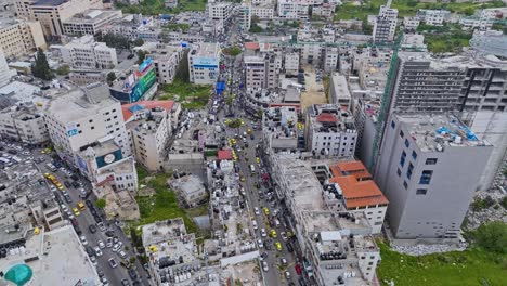 bustling streets with traffic through skyline of hebron in west bank of palestine