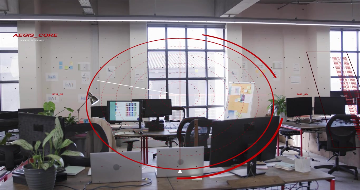 Apparizione di un anello rosso tenue, anelli HUD che si espandono, mirino che si fissa sulla scrivania, telecamera con panoramica verso l'interno