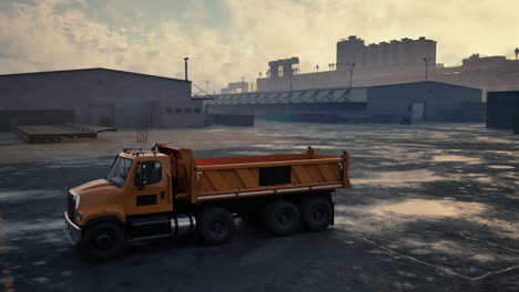 orange dump truck in industrial setting