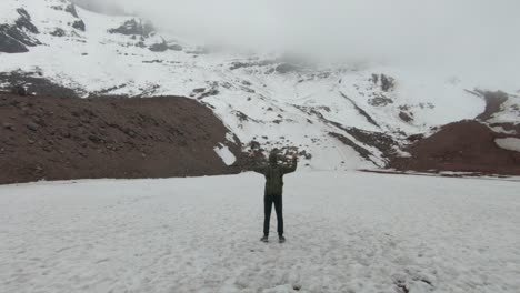 base of chimborazo mountain volcano stratovolcano covered in snow, tourist admiring