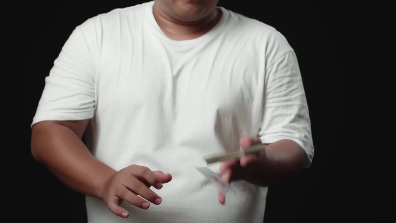 Trick Of Magician With The Card In Unusual Way, Throwing Cards, On Black Background