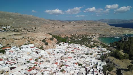 lindos clockwise rotate and flyover, revealing bay, aerial drone, rhodes, greece