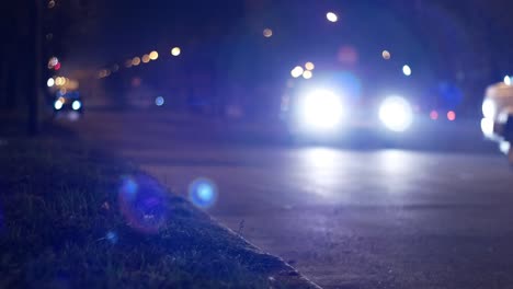 cinematic bokeh with night city street traffic. cars and people in the light of headlights and lanterns cinematic bokeh with night city street traffic. cars and people in the light of headlights and lanterns