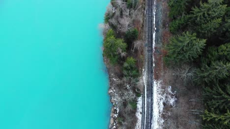 a slow slide over a mountain railways near an iced river