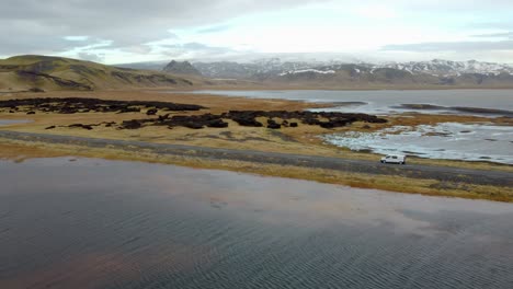 aerial view of white van driving on road in iceland