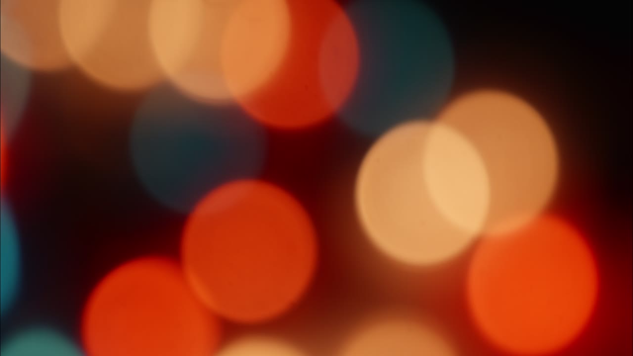 Abstract Background of Moving Colorful Bokeh Lights