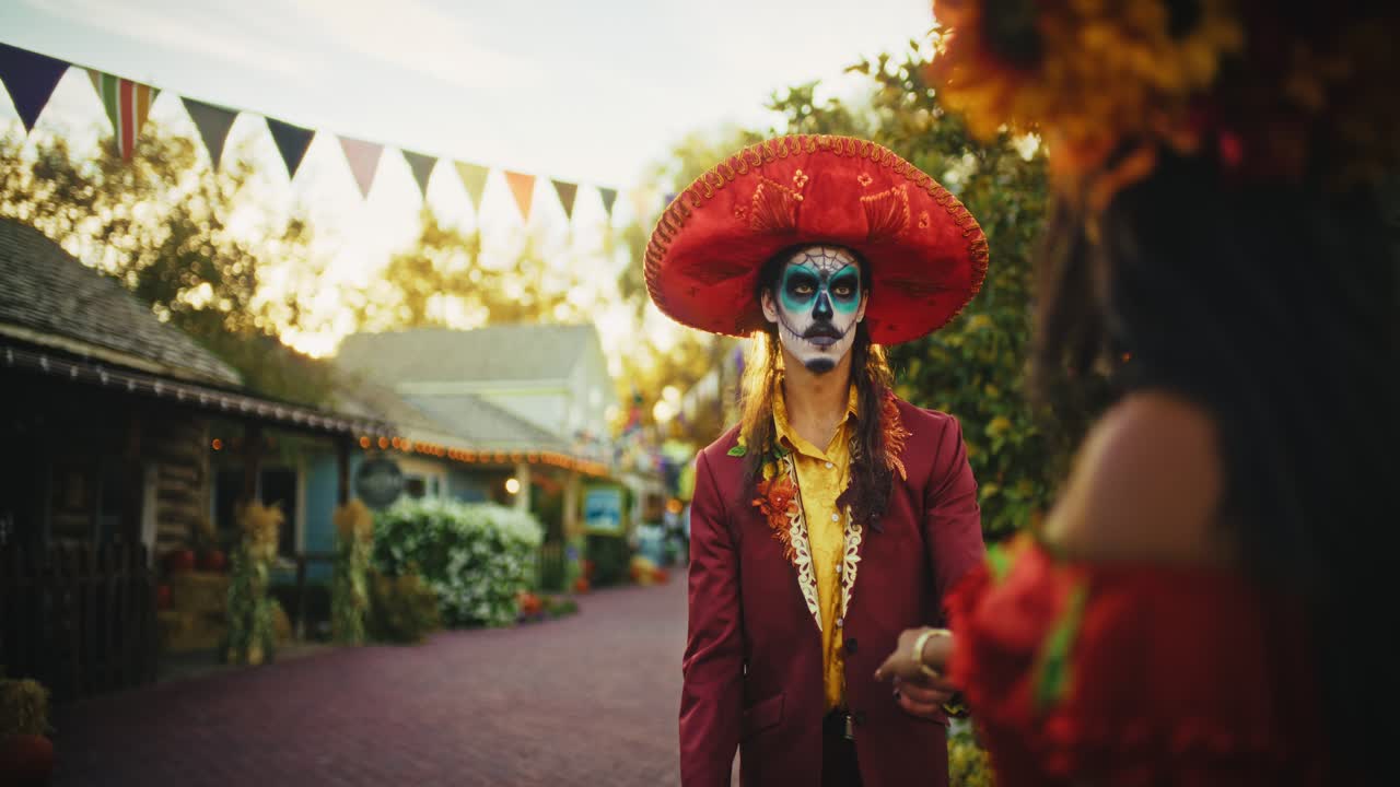 Couple Dancing in Day of the Dead Costumes
