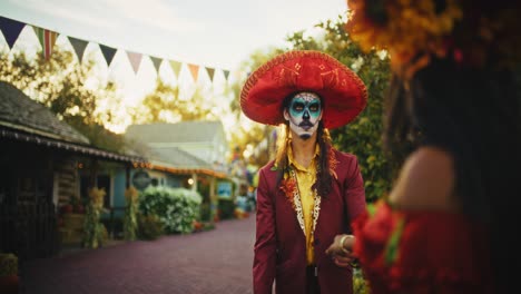 Couple Dancing in Day of the Dead Costumes