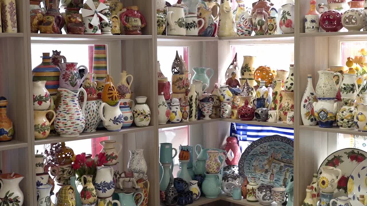 Handmade traditional ceramic artefacts and souvenir at small shop, Agiasos village, Mytilene, Lesvos, Gimbal shot