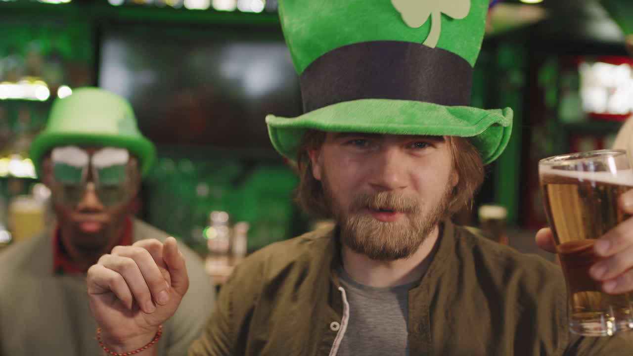 Bearded Man In Green Hat Dancing In Pub