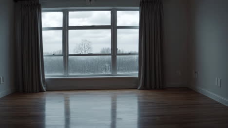 empty room with a view of a cloudy day