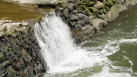 waterfall near covered bridge, thomas mill at the wissahickon creek