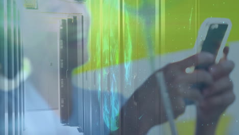 holding smartphone, hand showing animation over digital data center background