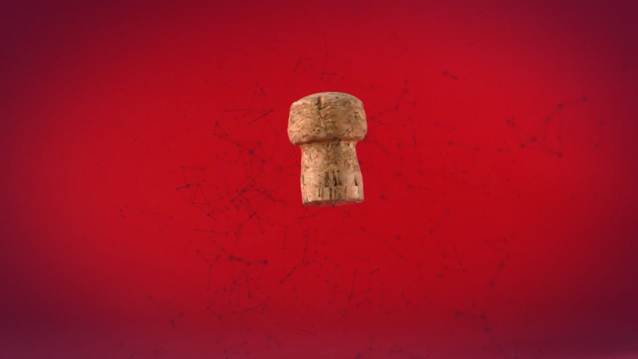 Rete di connessioni che fluttuano su un tappo di sughero di vino in caduta, su sfondo rosso.