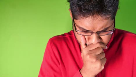 young asian man coughing and sneezes close up