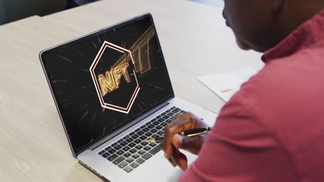 African-american-businessman-using-laptop-for-video-call-with-nft-text