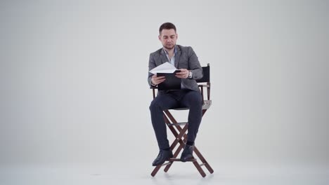 handsome businessman on background. young handsome businessman against studio background
