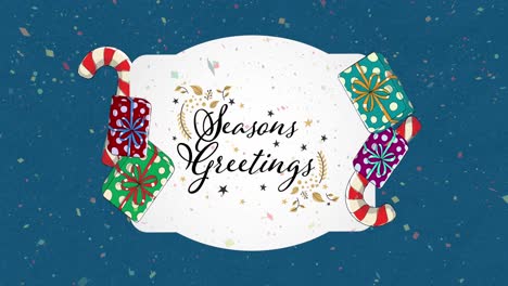 Animation-of-christmas-greetings-text-with-decoration-on-blue-background