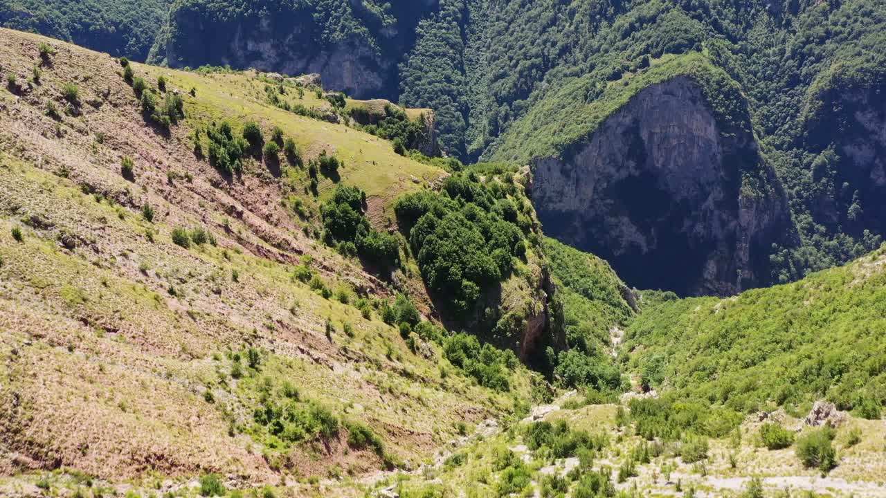 Breathtaking landscape of green forested mountains and cliffs