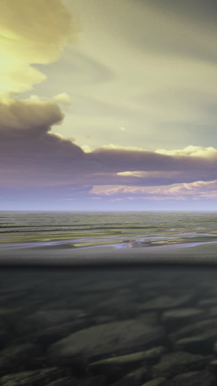 View of ocean under clouds during sunset with waves rolling on shore