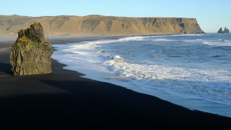 view of the black sand beach from dyrhólaey in vik, iceland.