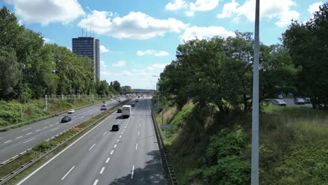 katowice a4 highway with medium traffic flow during a summer day - cars and trucks driving road - aerial view 4k