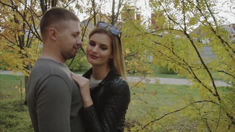 couple kissing in autumn park