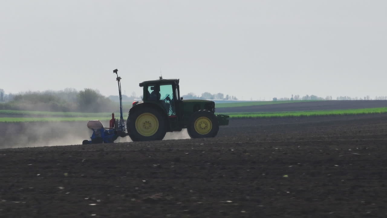 Farmer Planting Crops in a Field