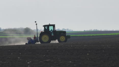 farmer planting crops in a field