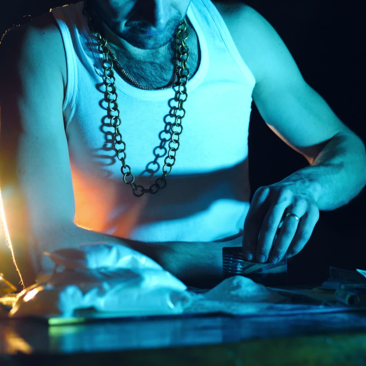 Addict prepares cocaine lines. The cocaine powder is sorted. The concept of drug abuse. Social problems