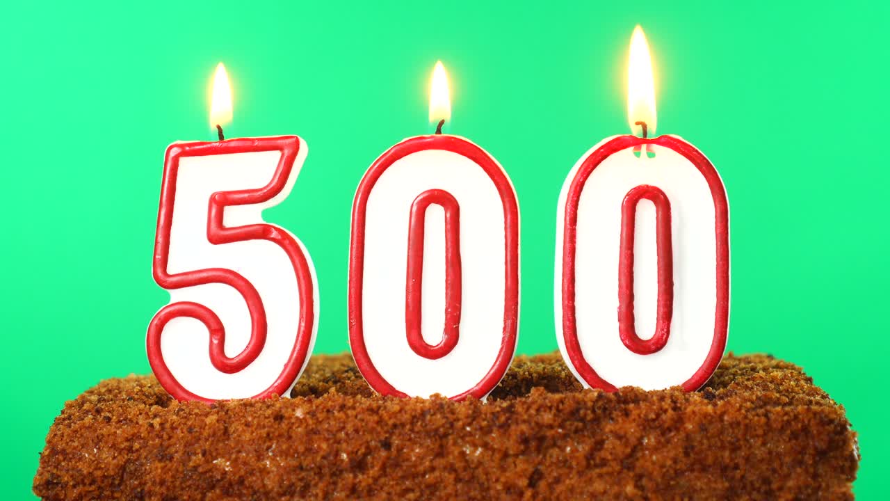 Cake with the number 500 lighted candle. Chroma key. Green Screen. Isolated