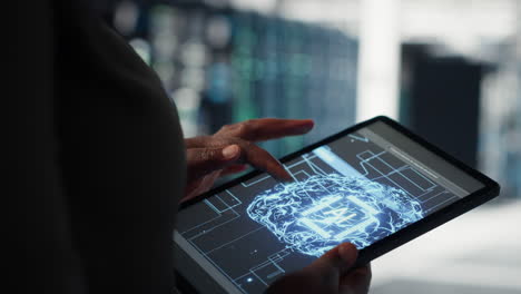 lose up of data center technician doing ai data analysis on tablet