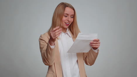 woman open envelope letter great news celebrate monetary award invitation bank loan approve