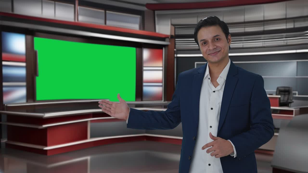 Happy Indian journalist pointing to Copy Space and showing thumbs up