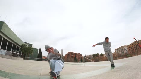 breakdancers performing and handshaking in urban environment