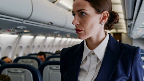 flight attendant in airplane cabin