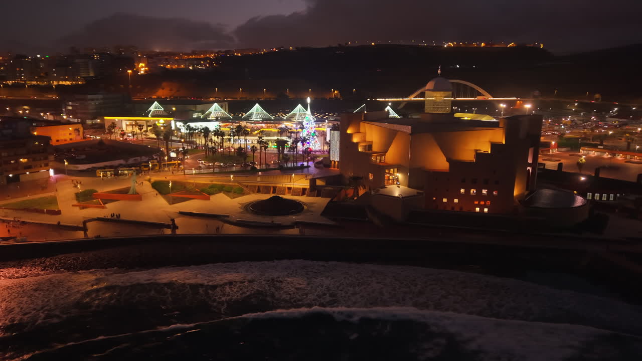 Aerial view of Las Canteras beach and Alfredo Kraus Auditorium at christmas night. Las Palmas city. Gran Canaria