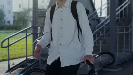 teenager with backpack and bicycle