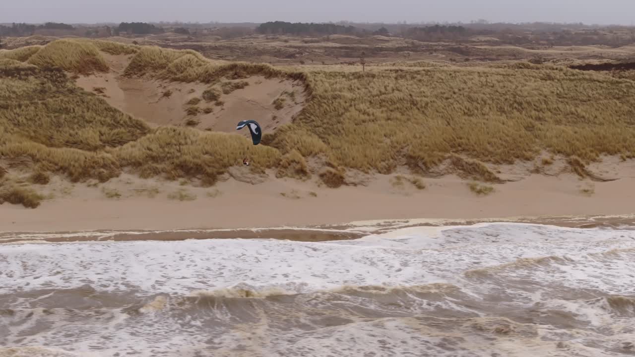 Paragliding over the dunes and beach
