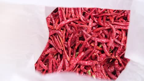 dried red chili peppers in a plastic bag