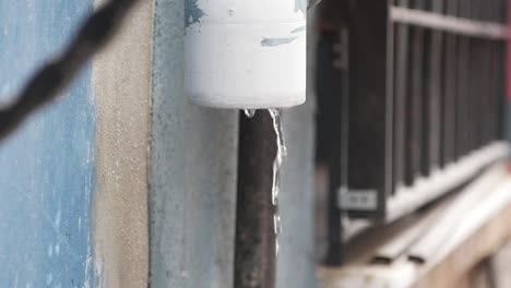 water dripping from a gutter