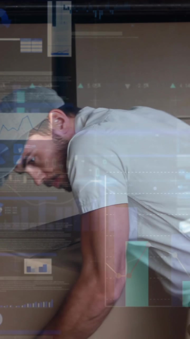 Man Lifting Boxes in Warehouse with Digital Data Overlay