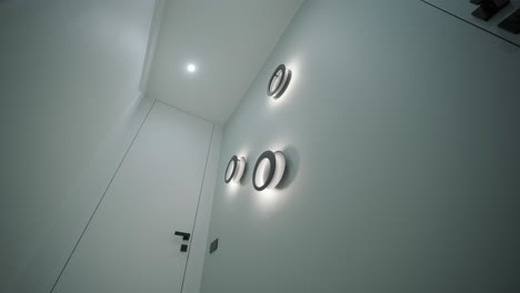 minimalist hallway with modern circular wall lights